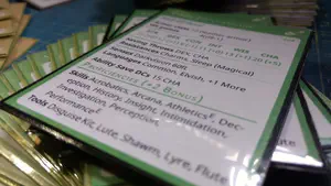 Stack of green-bordered Dungeons & Dragons feature cards, with character card at the top.